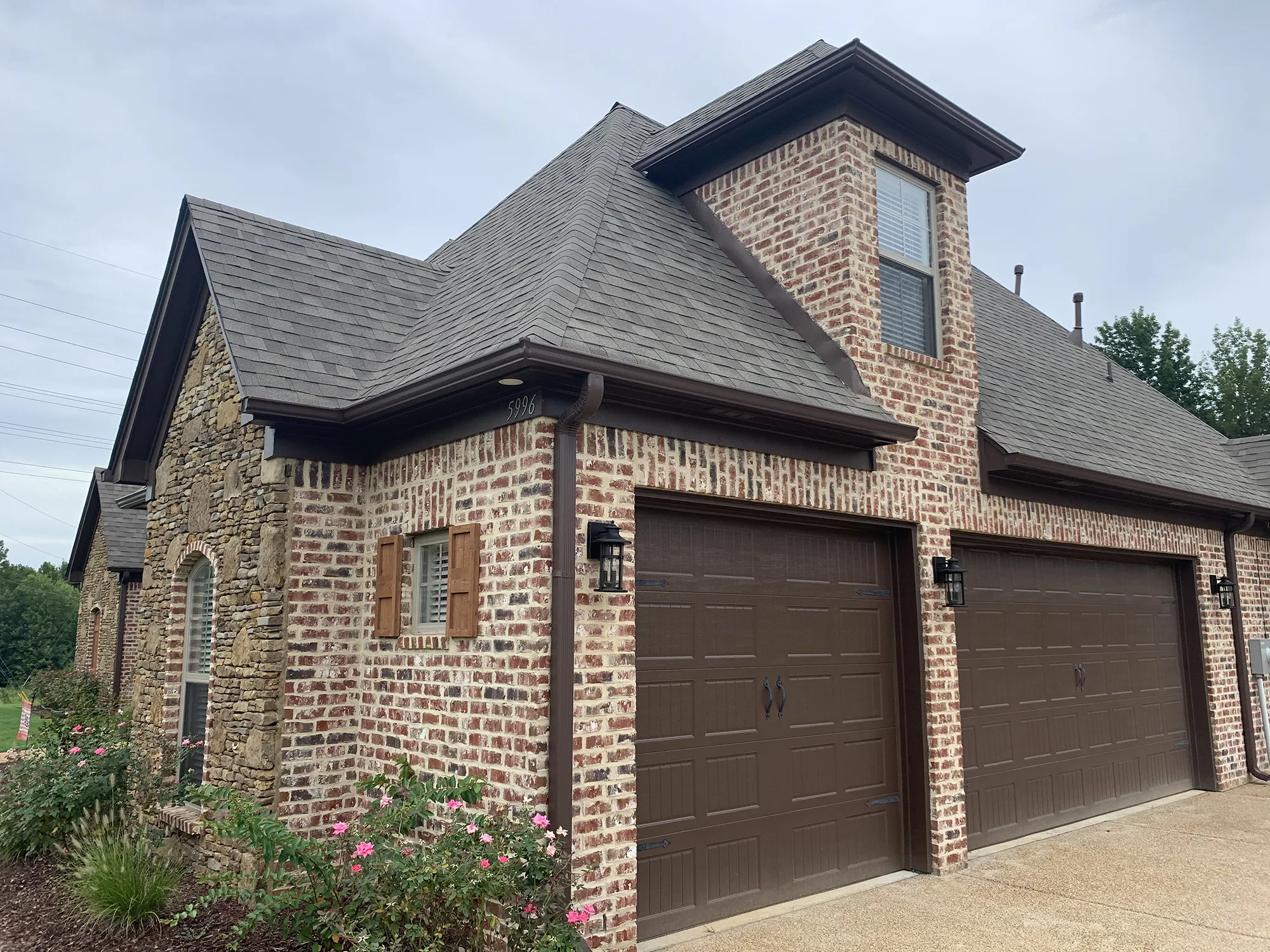 Brick house with garage doors
